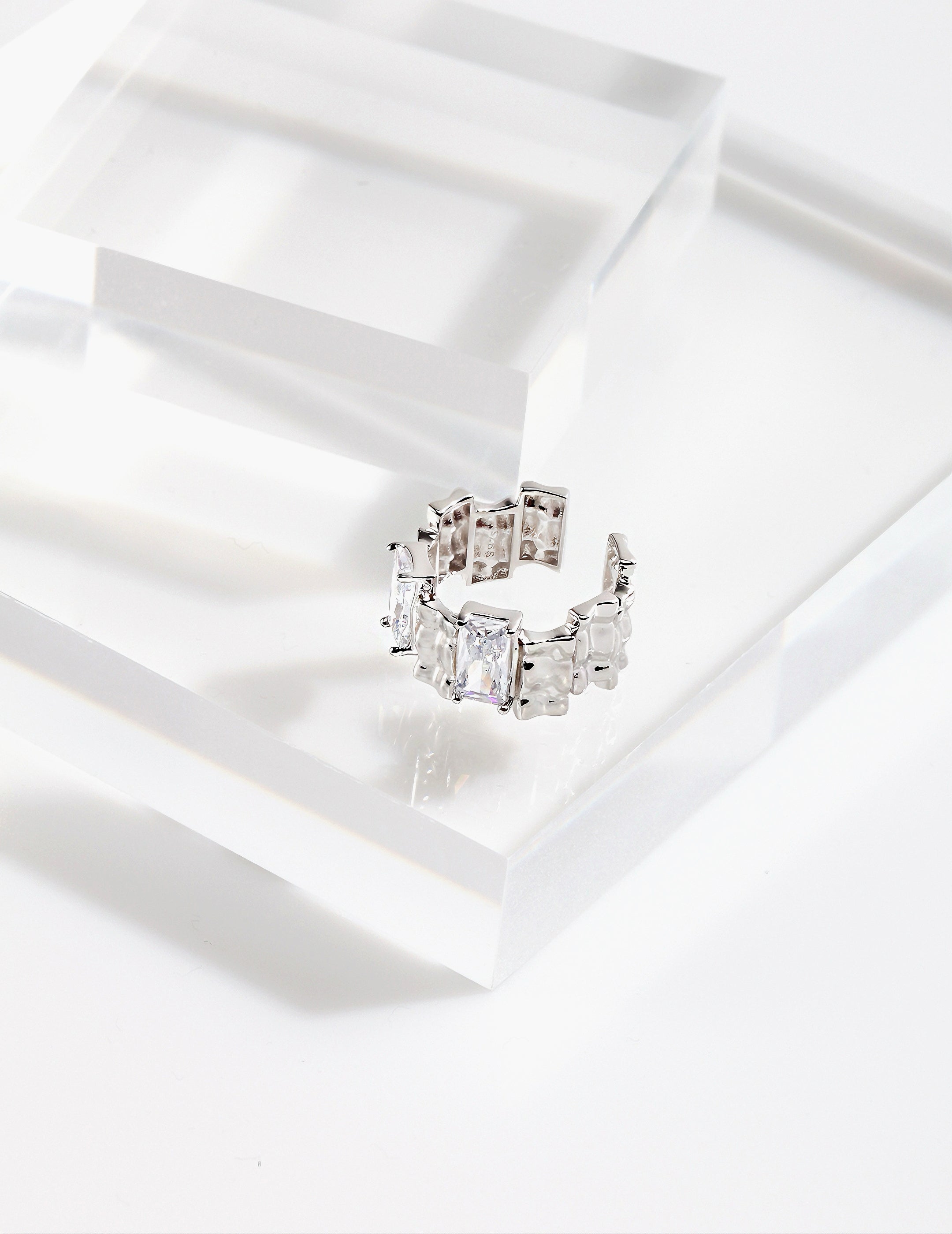 Ring with irregular rectangular spaced zircon design