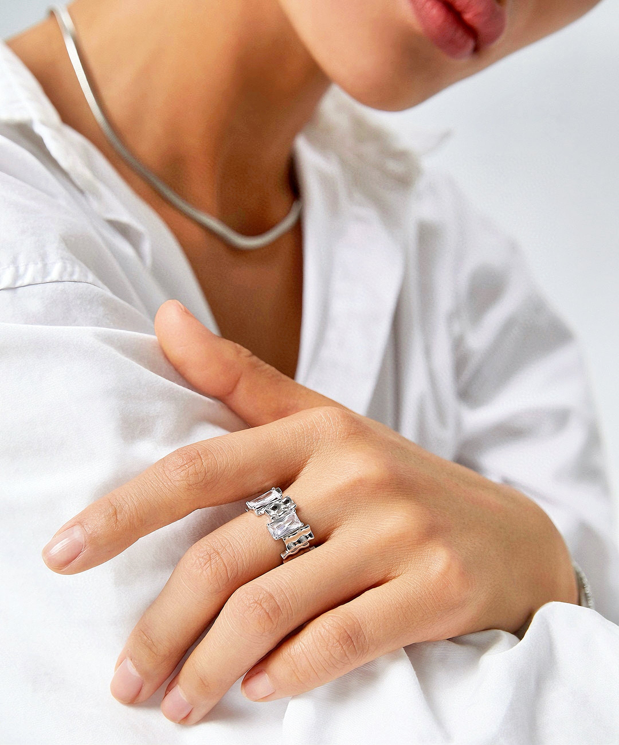 Ring with irregular rectangular spaced zircon design