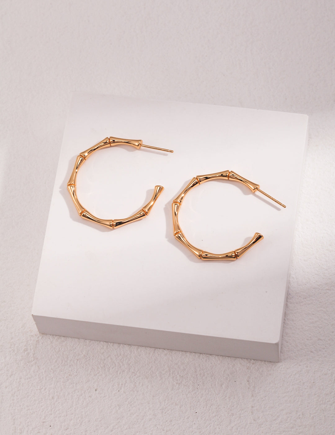 Sterling silver half-hoop earrings; bamboo joint earrings
