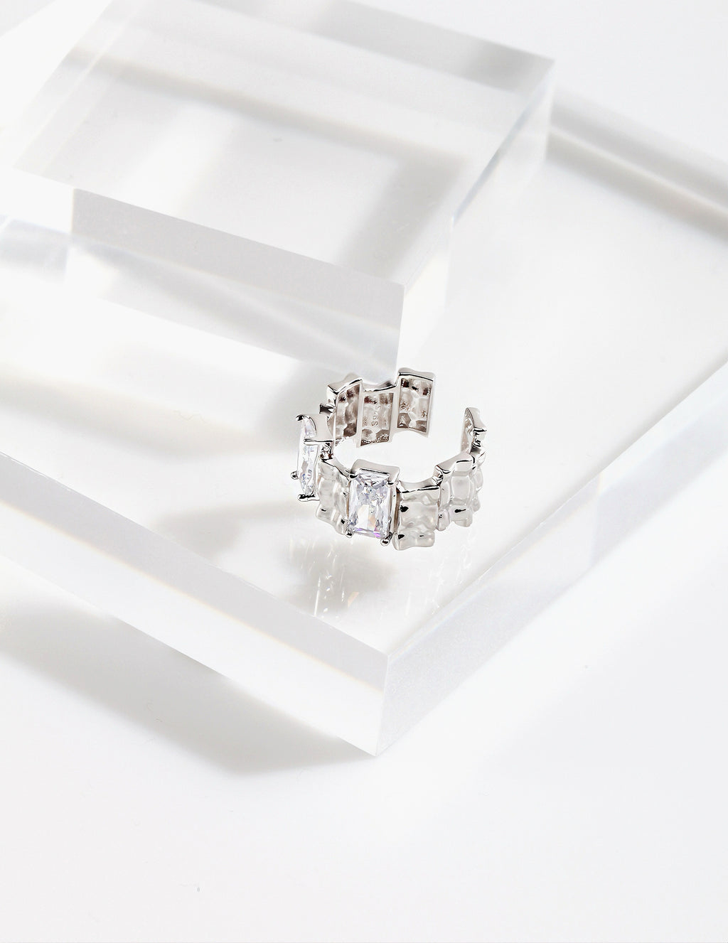 Ring with irregular rectangular spaced zircon design