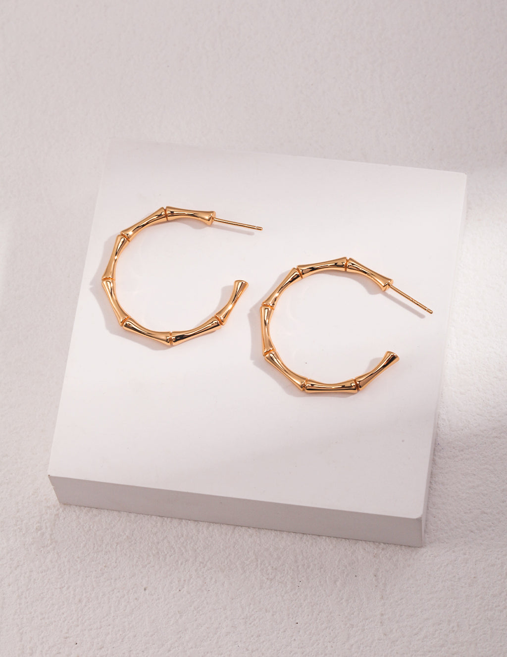 Sterling silver half-hoop earrings; bamboo joint earrings
